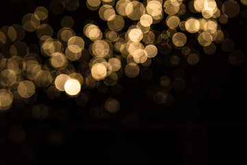 Abstract gold bokeh with black background