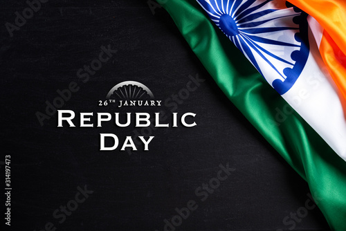 Indian republic day concept. Indian flag with the text Happy republic day against a blackboard background. 26 January.