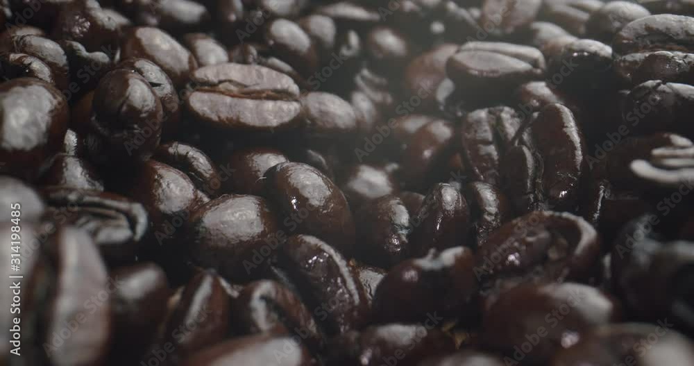 Macro Probe Shot of Dark Coffee Beans. Shot in 4K RAW on a cinema camera. Macro Probe Shot of Dark Coffee Beans. Shot in 4K RAW on a cinema camera.