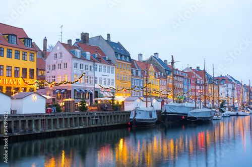 Nyhavn embankment with old ships along the Nyhavn Canal in Copenhagen, Denmark