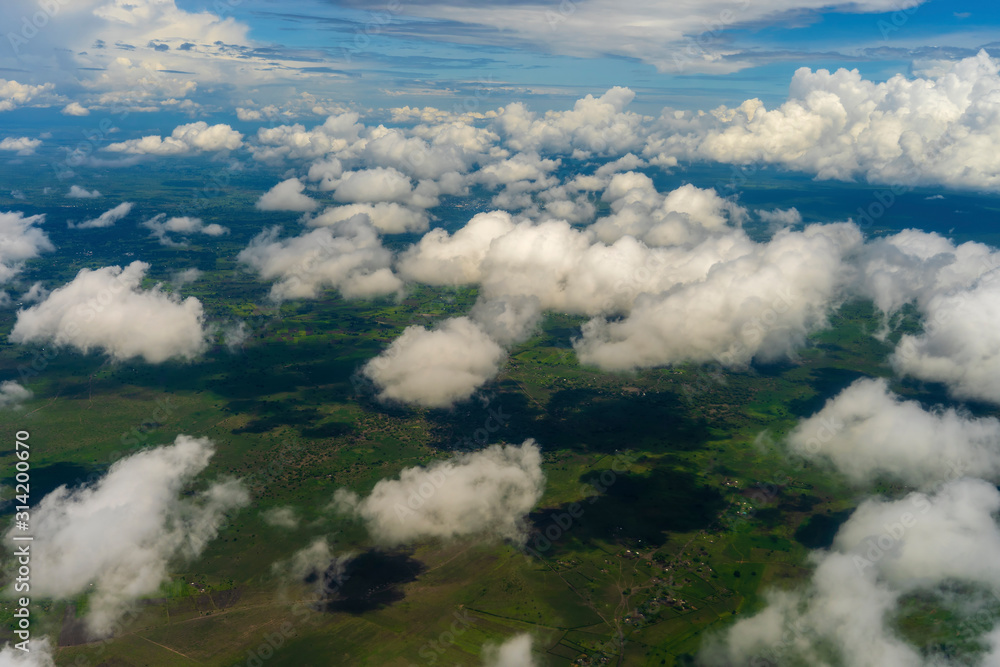 Flying above the earth and above the clouds in territory of Tanzania, Africa Flying above the earth and above the clouds in territory of Tanzania, Africa