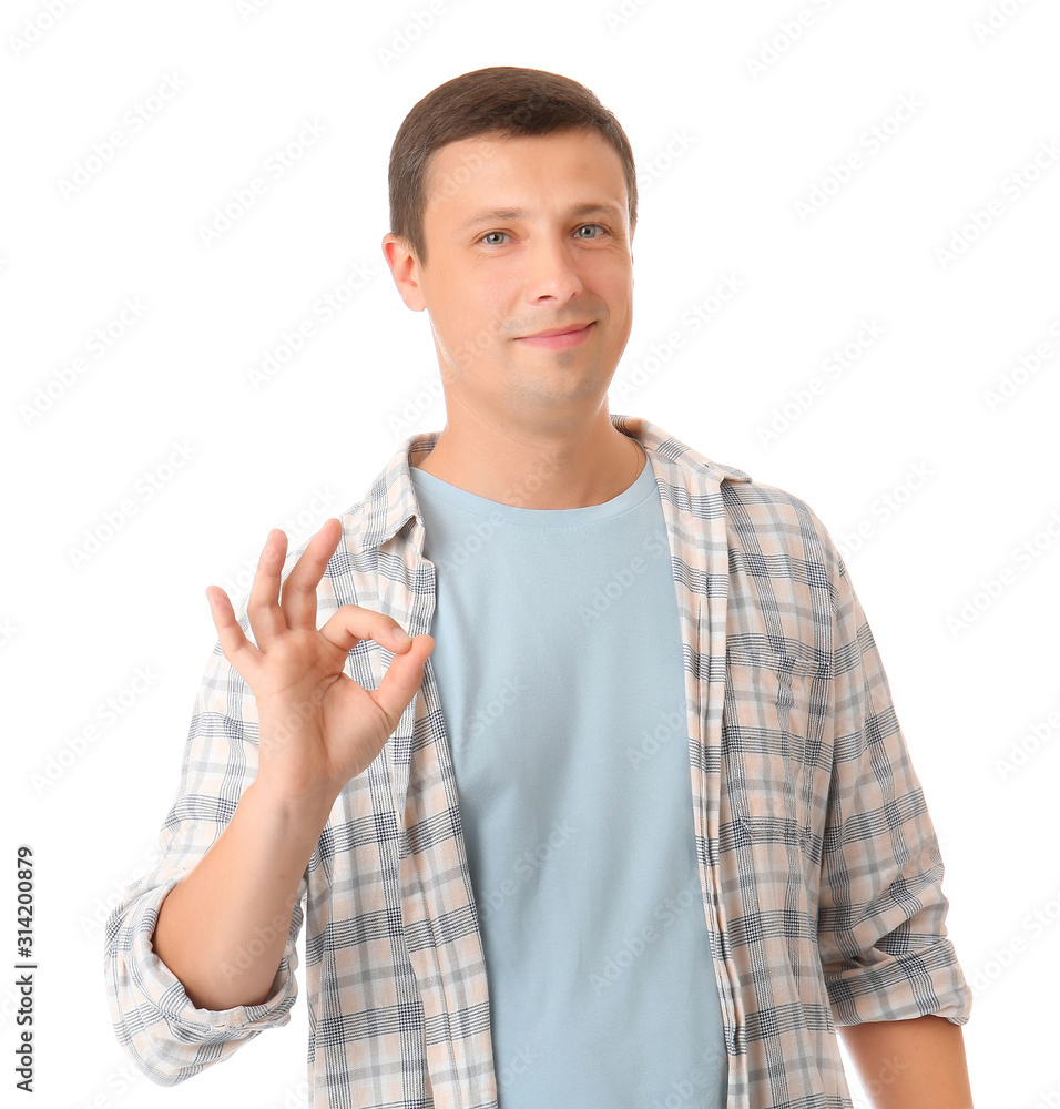 Portrait of handsome man showing OK gesture on white background Portrait of handsome man showing OK gesture on white background
