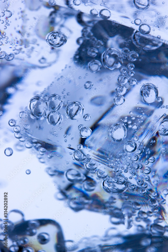 background of ice cubes doused with mineral water with air bubbles background of ice cubes doused with mineral water with air bubbles