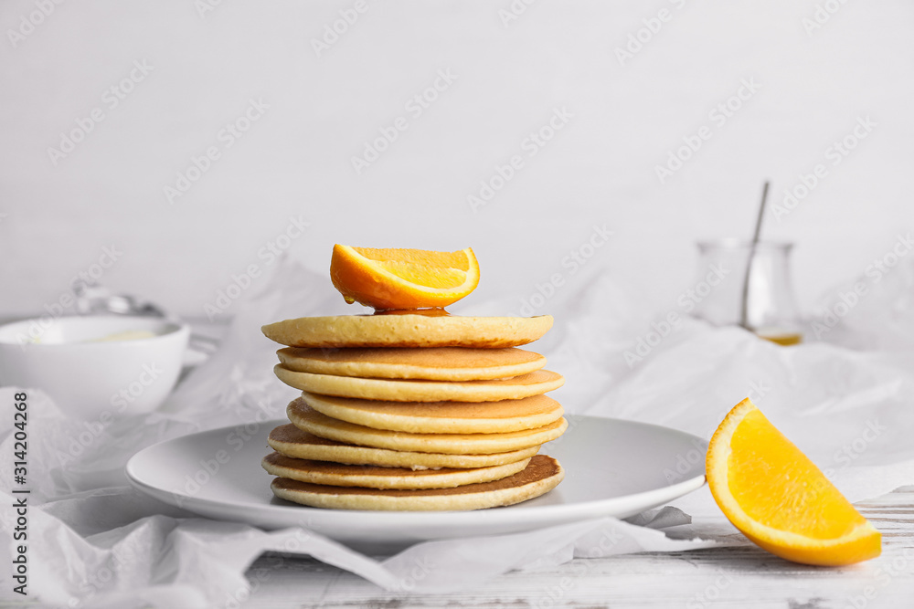 Plate with stack of tasty pancakes on table Plate with stack of tasty pancakes on table