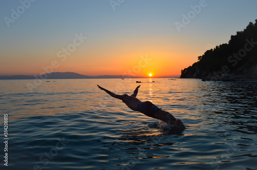 silhouette of man on the beach