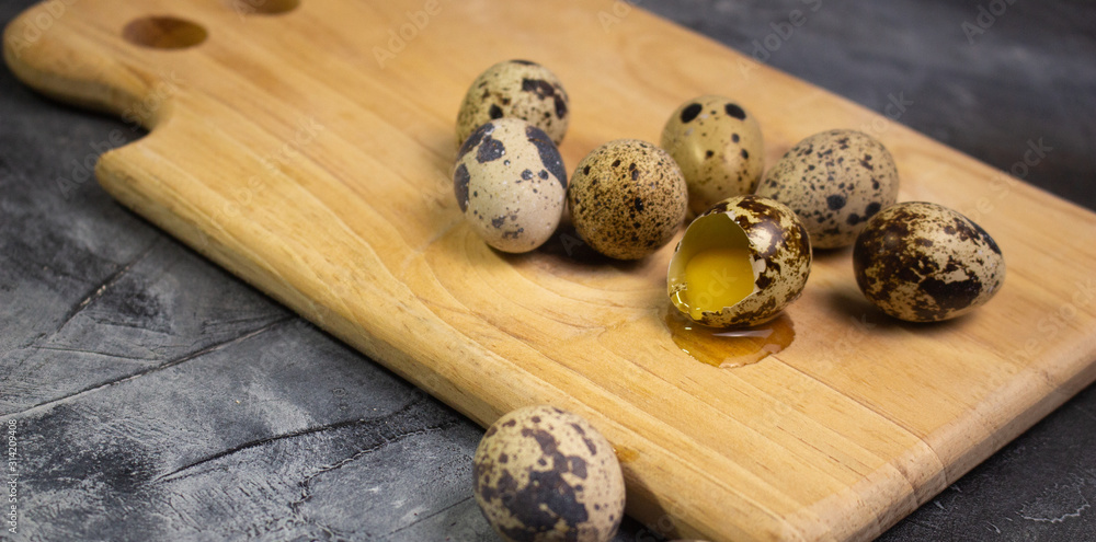 Quail eggs on wooden board , cooking concept Quail eggs on wooden board , cooking concept