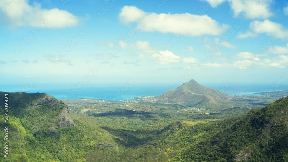 Aerial HYPERLAPSE over the Mauritius Island with Blue Sky and Traveling Clouds.
Forward Moving Drone Timelpase on Green Vegetation Toward the Coastline. Aerial HYPERLAPSE over the Mauritius Island with Blue Sky and Traveling Clouds.
Forward Moving Drone Timelpase on Green Vegetation Toward the Coastline.