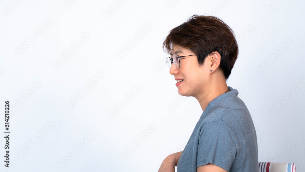 Portrait of short haired Asian woman smiling Wear glasses to turn the side. On a white background Portrait of short haired Asian woman smiling Wear glasses to turn the side. On a white background