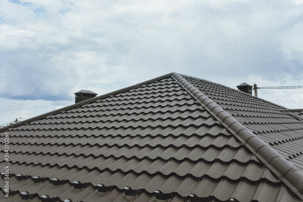 Corrugated metal roof and metal roofing. Modern roof made of met Corrugated metal roof and metal roofing. Modern roof made of met