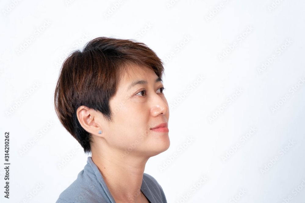 Portrait of short-haired Asian woman smiling side-facing On a white background Portrait of short-haired Asian woman smiling side-facing On a white background