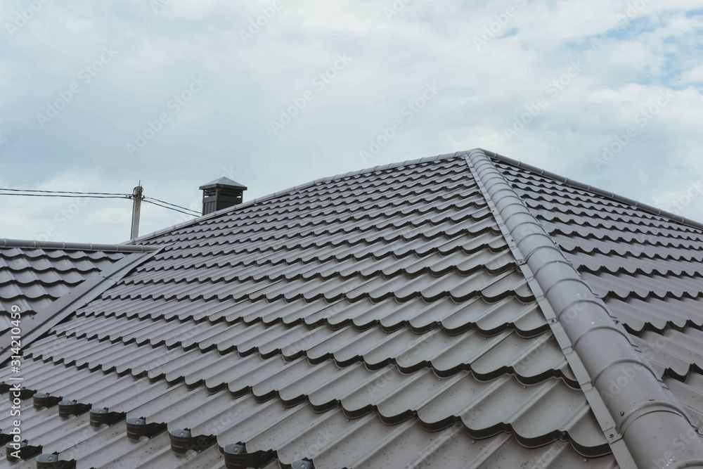 Corrugated metal roof and metal roofing. Modern roof made of met Corrugated metal roof and metal roofing. Modern roof made of met