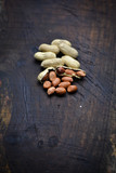 Peanuts or arachis hypogaea on old wood background