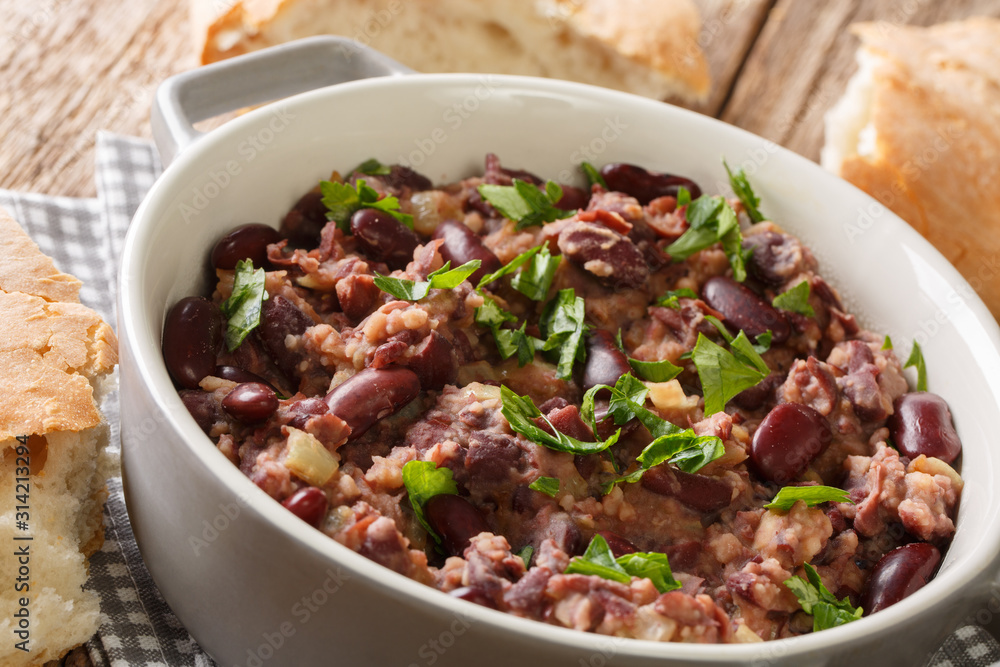 Tasty vegetarian Georgian lobio served with bread close-up in a pan. horizontal Tasty vegetarian Georgian lobio served with bread close-up in a pan. horizontal