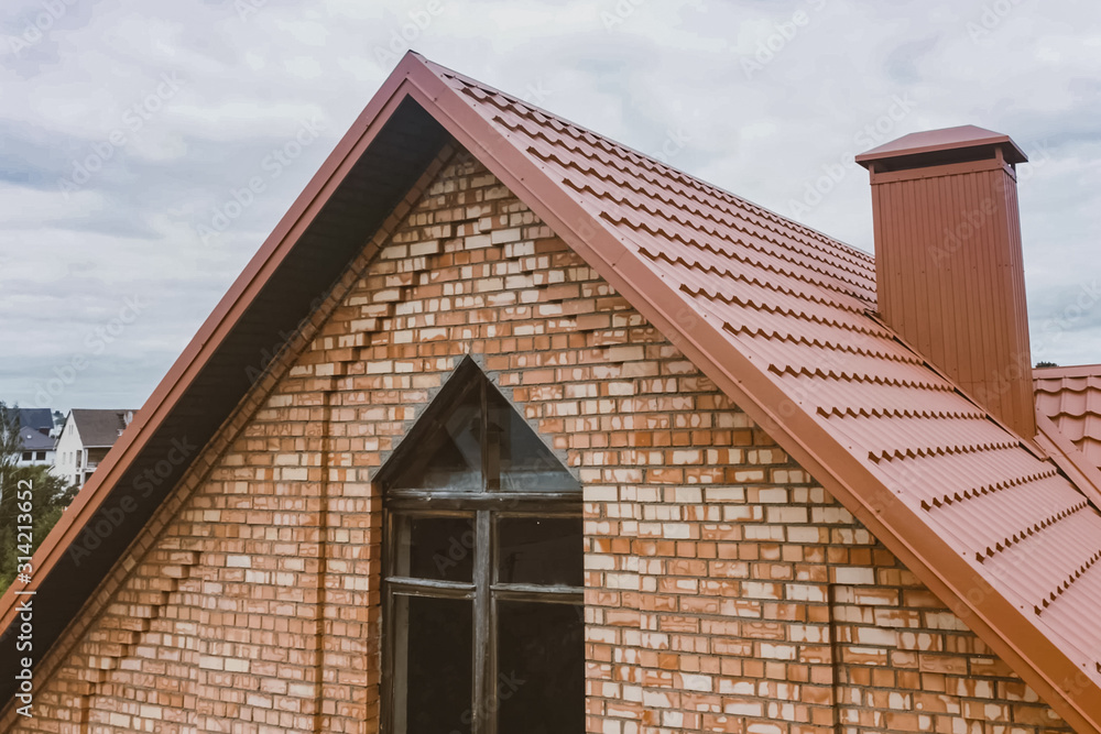 Beautiful pink brick brick house and orange roof. Corrugated met