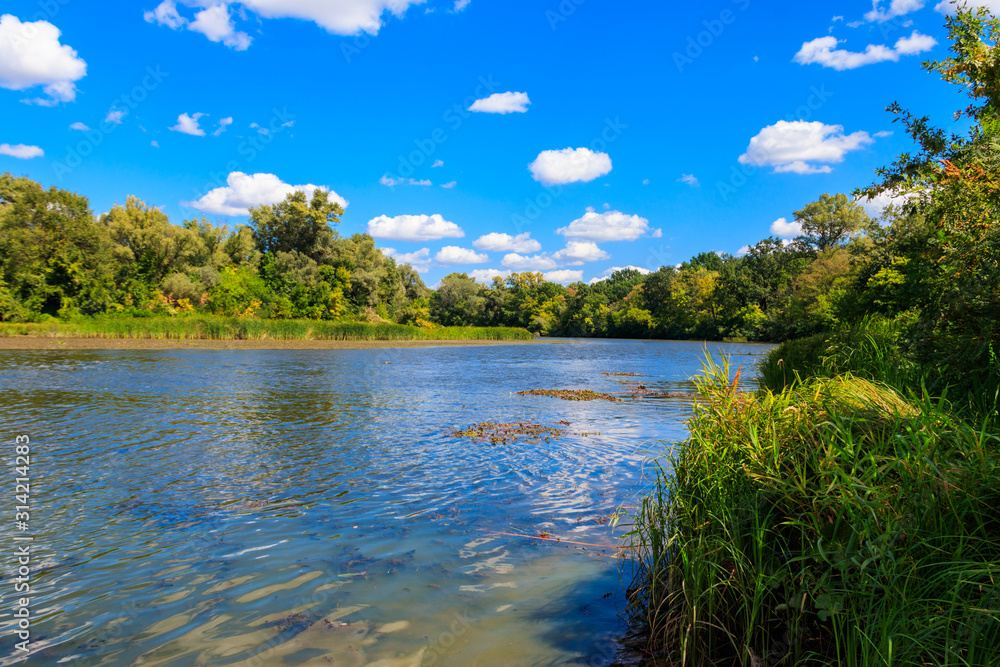 Summer landscape with beautiful river, green trees and blue sky Summer landscape with beautiful river, green trees and blue sky