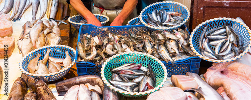 Selling fish in the market, Fez, Morocco.