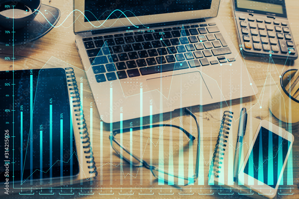 Double exposure of chart and financial info and work space with computer background. Concept of international online trading. Double exposure of chart and financial info and work space with computer background. Concept of international online trading.