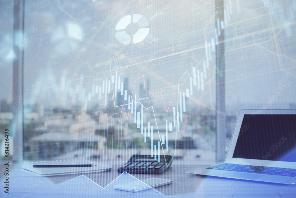 Forex Chart hologram on table with computer background. Multi exposure. Concept of financial markets. Forex Chart hologram on table with computer background. Multi exposure. Concept of financial markets.