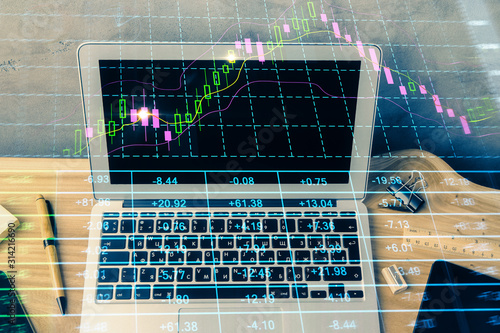 Double exposure of forex graph and work space with computer. Concept of international online trading. © peshkova