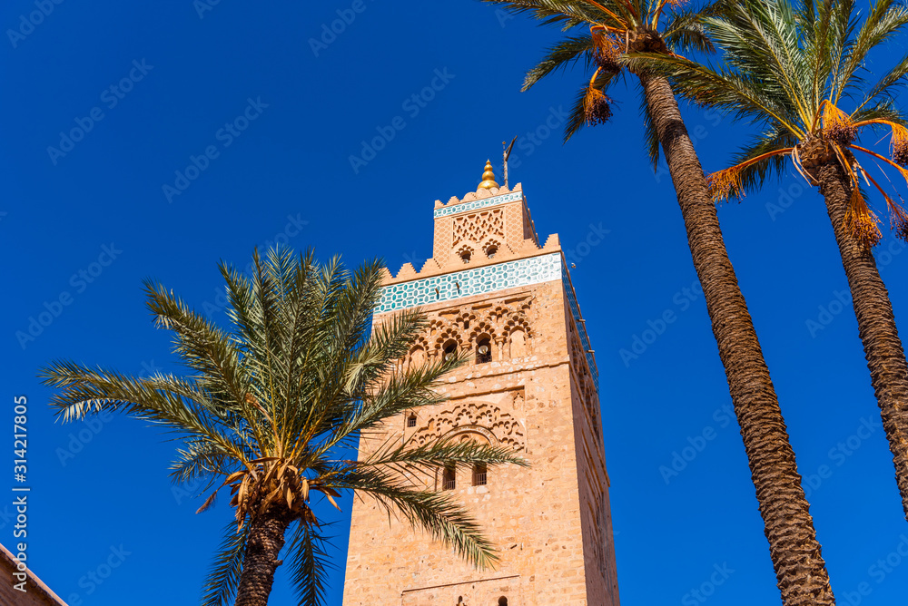 Koutoubia Mosque on a background of blue sky, Marrakesh, Morocco. Isolated on blue background.
