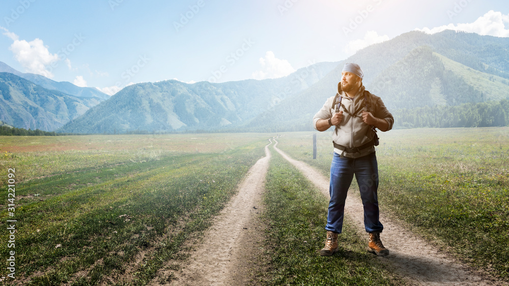 Obraz premium Hiker man in mountains. Mixed media