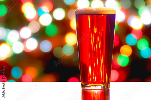 Εκτύπωση καμβά A close up of a Red Ale Beer with defocused lights in the background