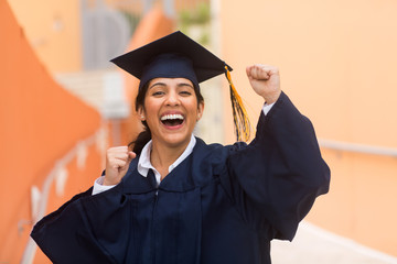 Young hispanic female graduate at her graduation