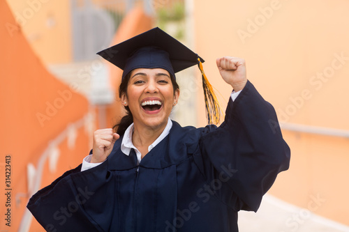 Young hispanic female graduate at her graduation photo