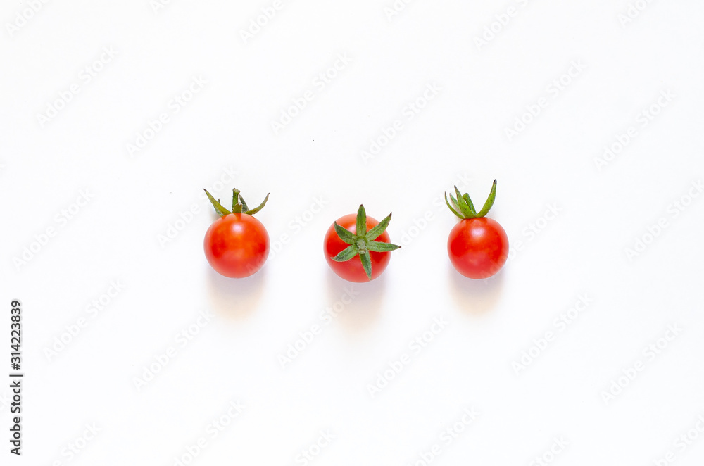 Cherry tomatoes isolated on a white background. Close-up. Cherry tomatoes isolated on a white background. Close-up.