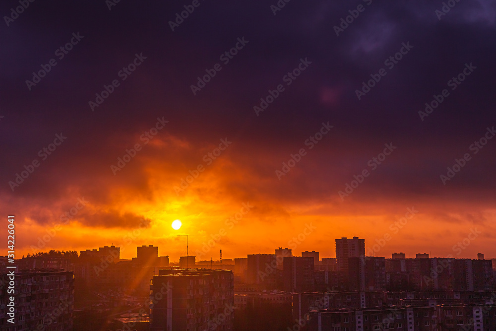 Morning sunrise over the city residential houses