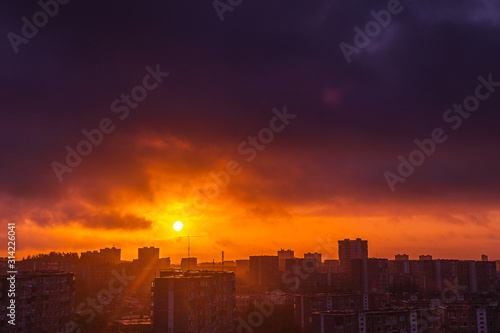 Morning sunrise over the city residential houses