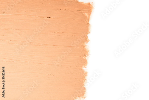 Liquid foundation texture. Make up for women. Top view. Isolated on white. Space for text or design.
