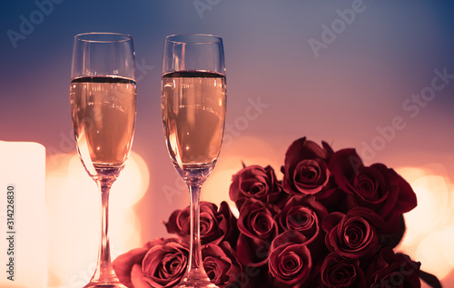 Valentine's Day, and romantic date night concept.  Champagne and roses.  photo