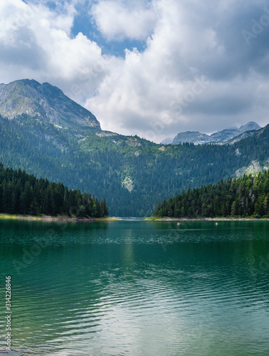 Black lake (Crno jezero) summer landscape. Zabljak Municipality, Montenegro. People unrecognizable.
