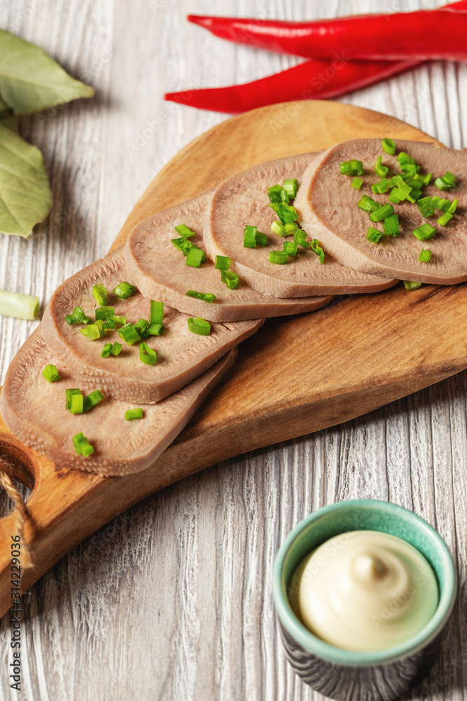 Beef tongue - sliced cooked cold  tongue with horseradish root sauce  