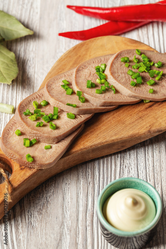 Beef tongue - sliced cooked cold tongue with horseradish root sauce 