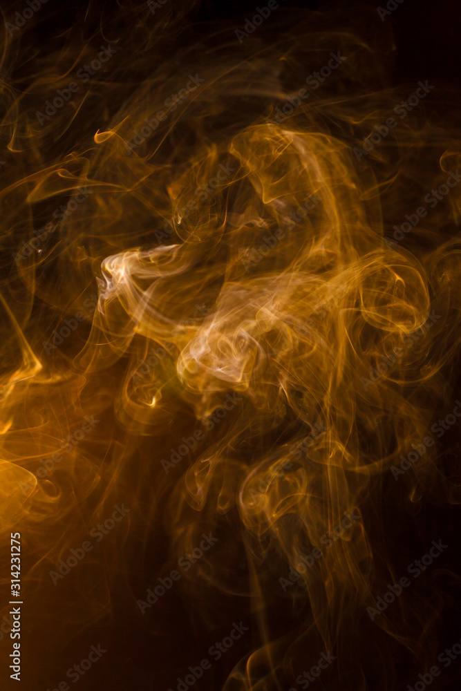 Obraz premium Gold smoke on black background.