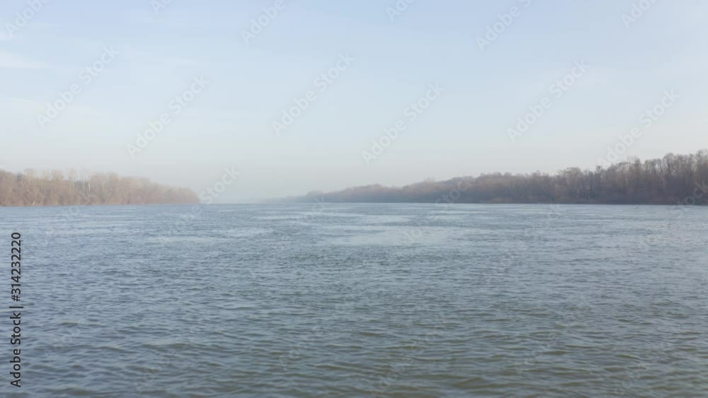 Cinematic fly over river in sunrise in autumn season. Amazing colorful nature with fogy background. Cinematic fly over river in sunrise in autumn season. Amazing colorful nature with fogy background.
