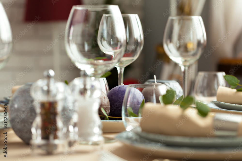 Table setting set with candles and plant branches Table setting set with candles and plant branches