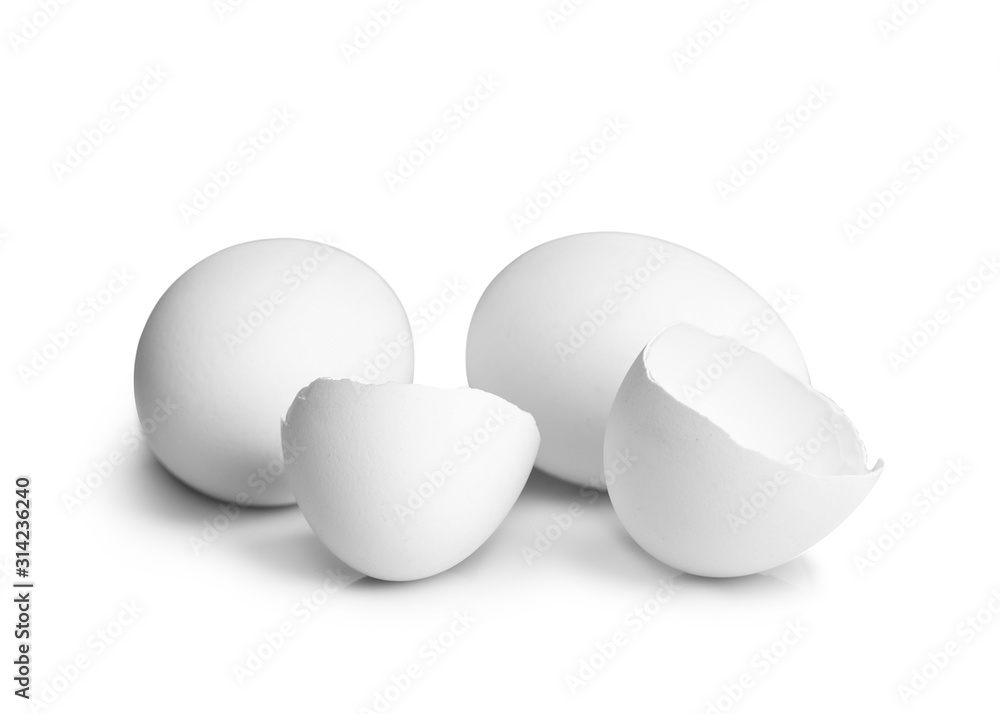 Chicken eggs and shell isolate on a white background. Chicken eggs shell close-up. A whole and broken chicken egg. Chicken eggs and shell isolate on a white background. Chicken eggs shell close-up. A whole and broken chicken egg.