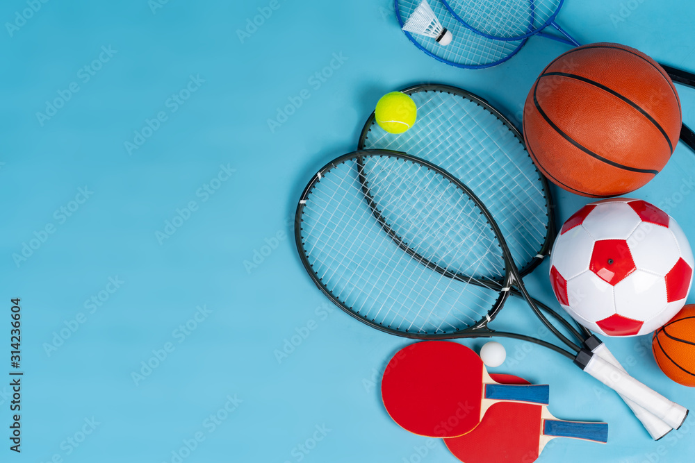 Sport equipment flat lay. Variety of rackets and balls