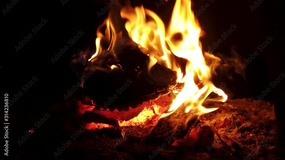 Slow motion of fire flames burning in a stove Slow motion of fire flames burning in a stove