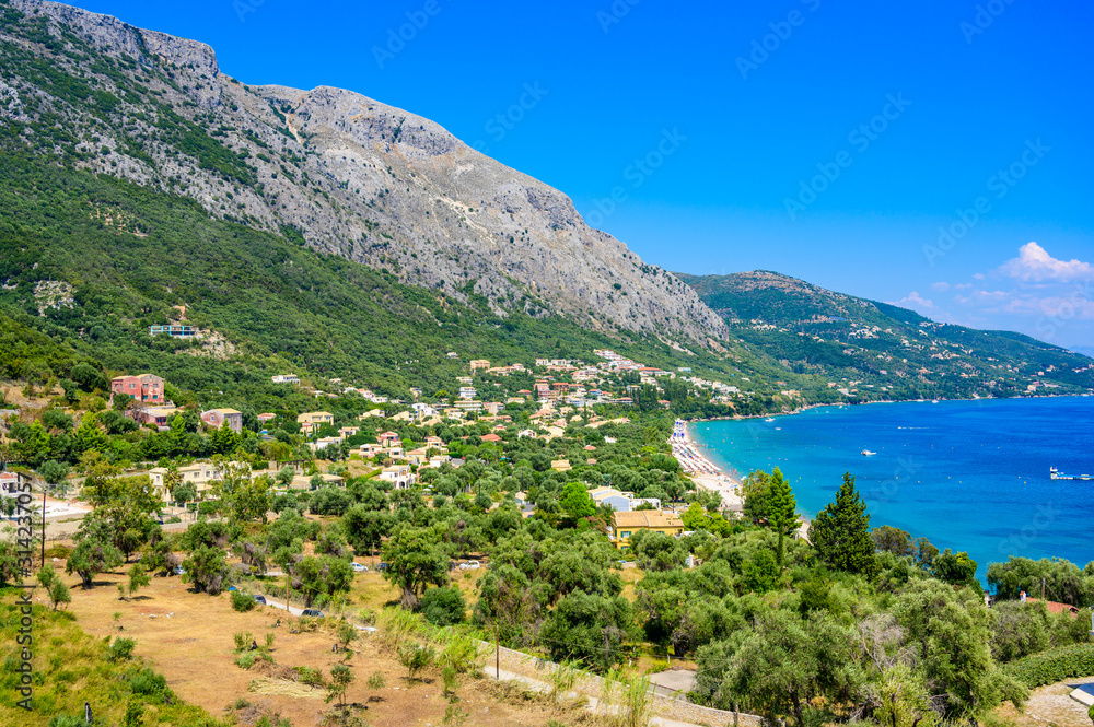 Obraz premium Barbati Beach with crystal clear azure water in beautiful landscape scenery - paradise coastline of Corfu island, Ionian archipelago, Greece.