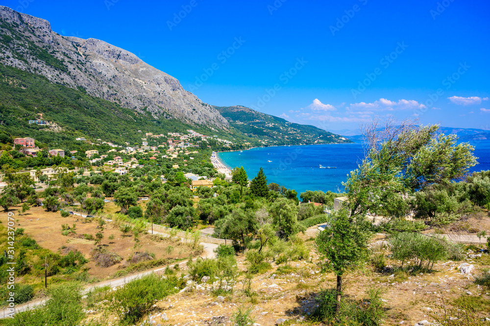 Barbati Beach with crystal clear azure water in beautiful landscape scenery - paradise coastline of Corfu island, Ionian archipelago, Greece.