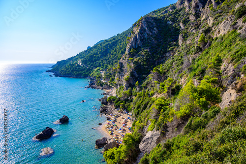 Fototapeta Naklejka Na Ścianę i Meble -  Mirtiotissa beach with crystal clear azure water and white beach in beautiful landscape scenery - paradise coastline of Corfu island close to Glyfada Beach, Ionian archipelago, Greece.