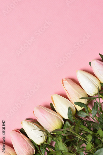 Fototapeta Naklejka Na Ścianę i Meble -  Beautiful template with text space and tulips in the corner on a pink background. Mothers Day or March 8 holidays concept.