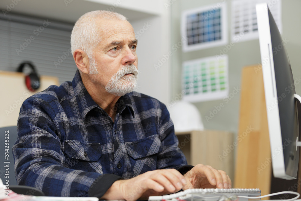 senior man using a computer senior man using a computer