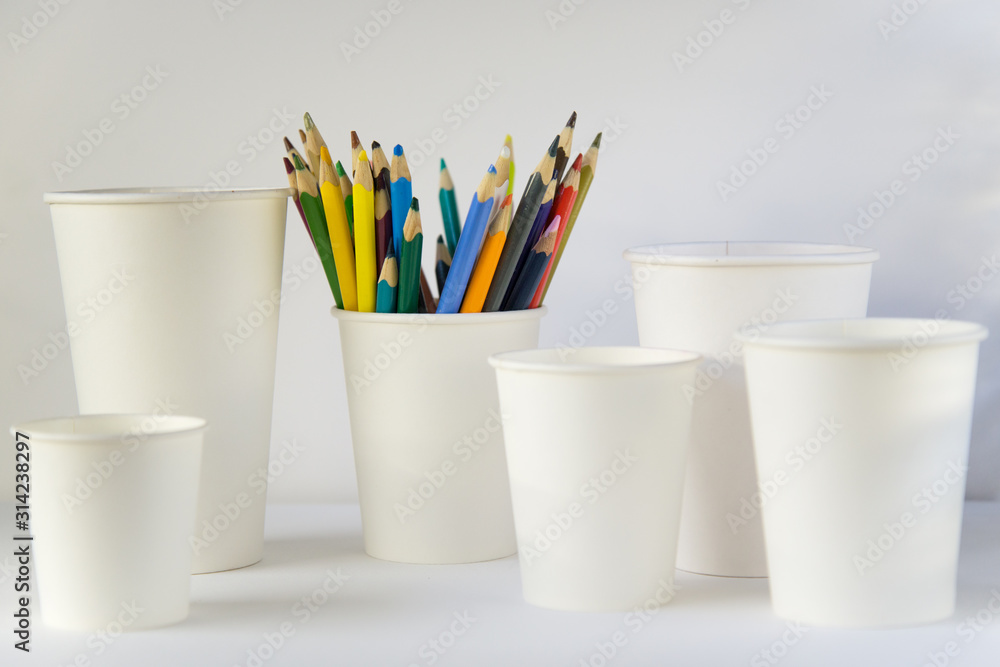 empty cardboard coffee Cup and colored pencils empty cardboard coffee Cup and colored pencils