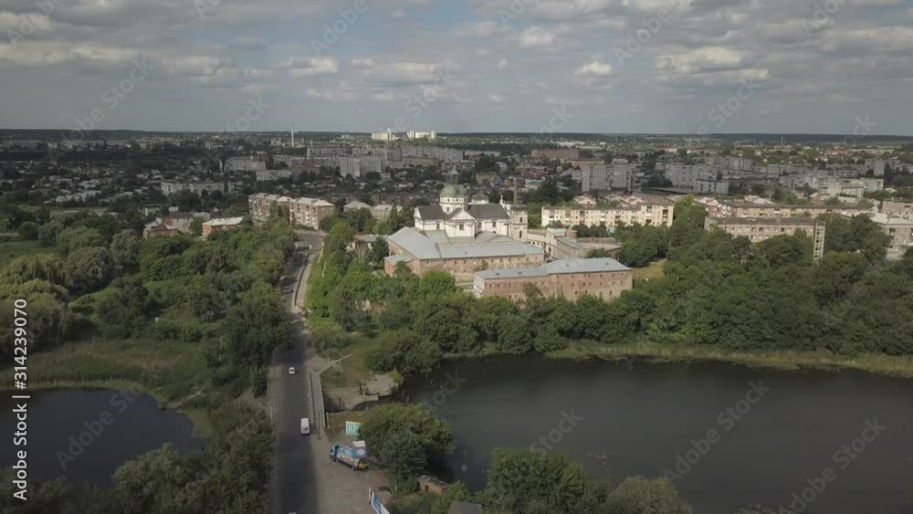 Berdychiv, Ukraine - 7 8 2019: Roman Catholic Church of the Blessed Virgin Mary. Aerial photography from a drone or quadrocopter of the monastery of Carmelite monks. The main sanctuary with defensive Berdychiv, Ukraine - 7 8 2019: Roman Catholic Church of the Blessed Virgin Mary. Aerial photography from a drone or quadrocopter of the monastery of Carmelite monks. The main sanctuary with defensive