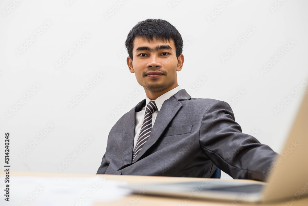 Thoughtful businessman sitting in office lobby stock photo Thoughtful businessman sitting in office lobby stock photo